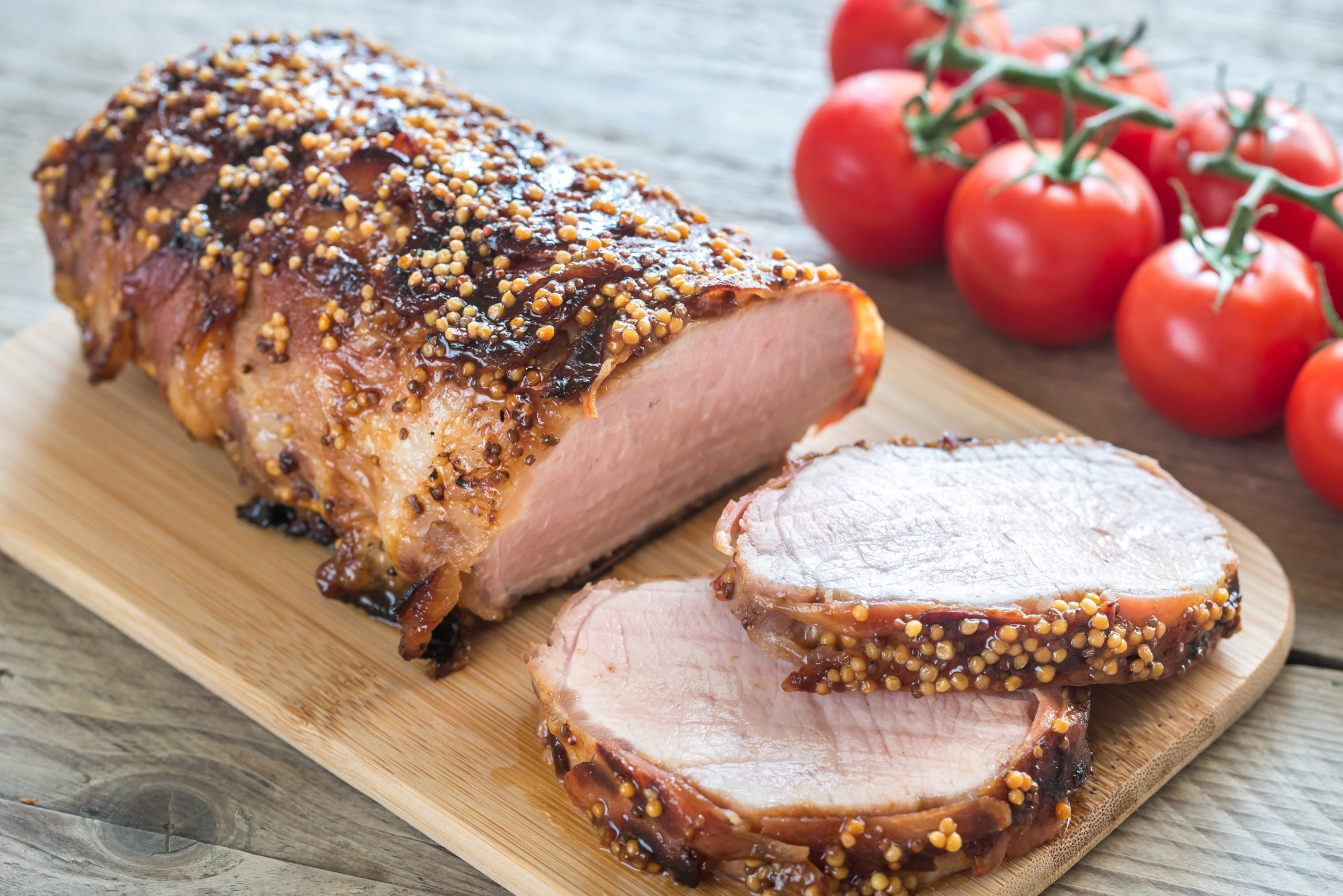 Baked pork meat wrapped in bacon